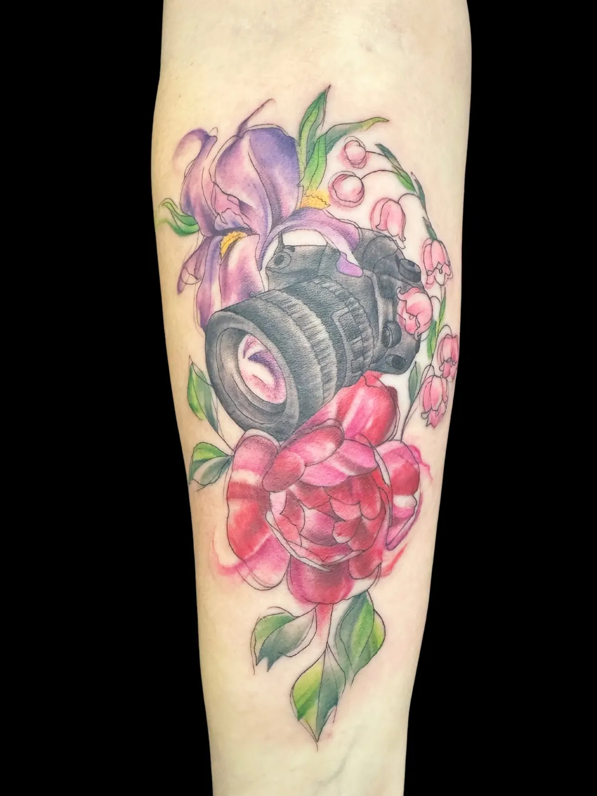Camera and flowers tattoo by Lacey Rawson