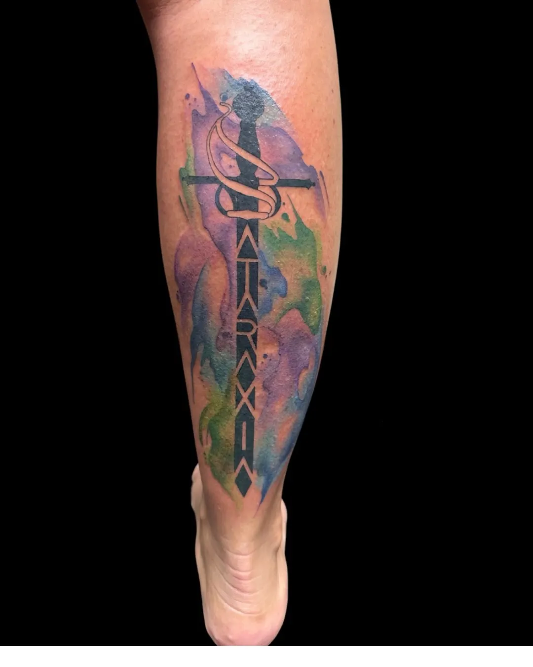 Cross watercolor tattoo by Lacey Rawson