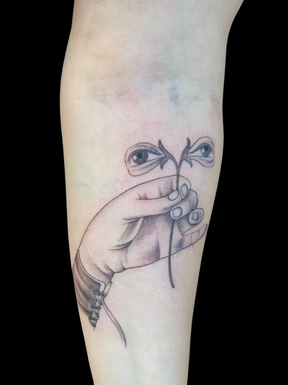 Surreal eyes black tattoo by Lacey Rawson