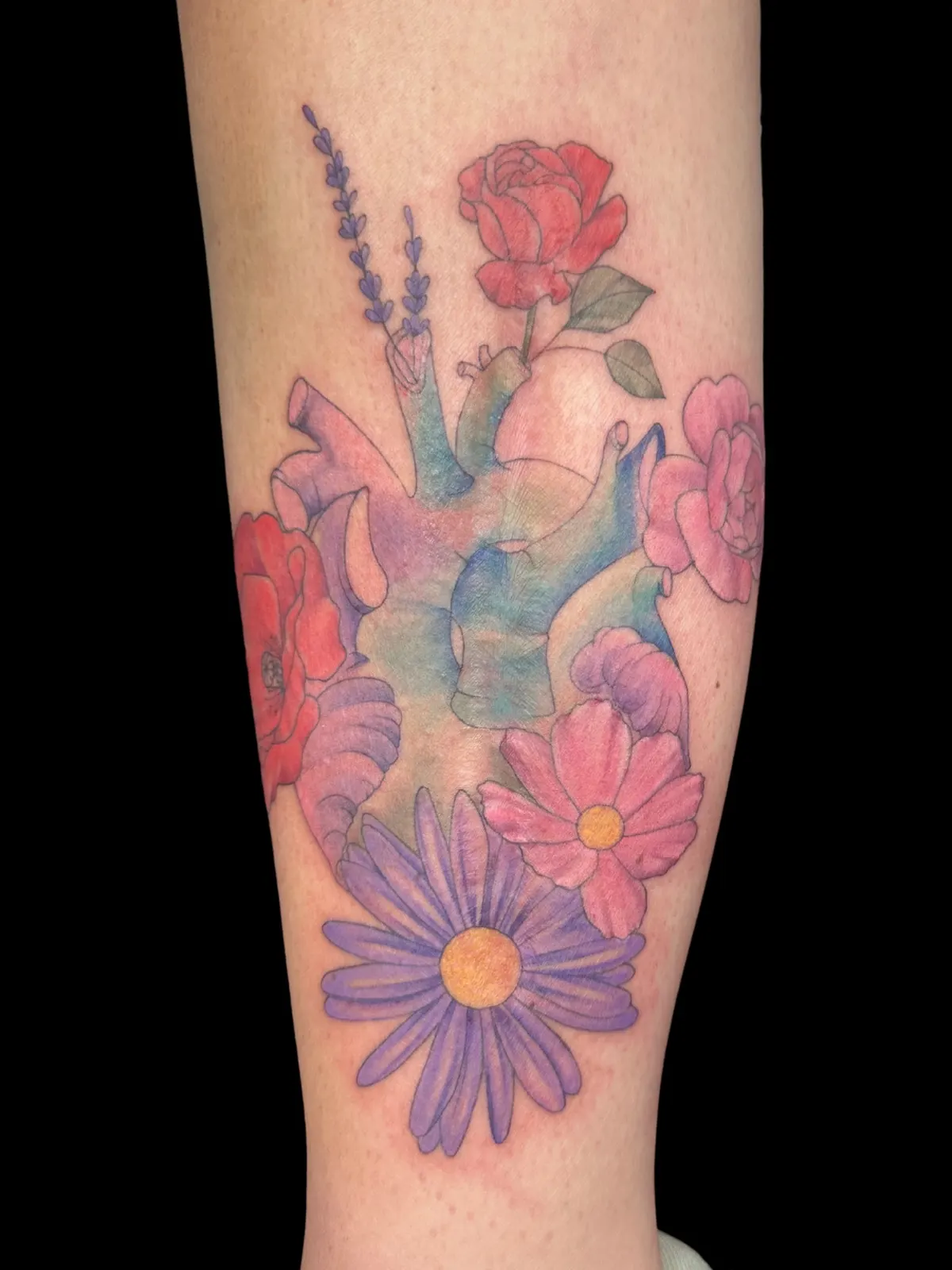 Flowers and heart tattoo by Lacey Rawson